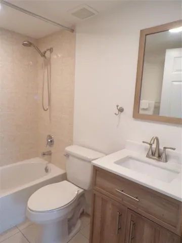 a bathroom with a sink toilet vanity and shower