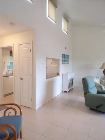 a view of a livingroom with furniture and windows