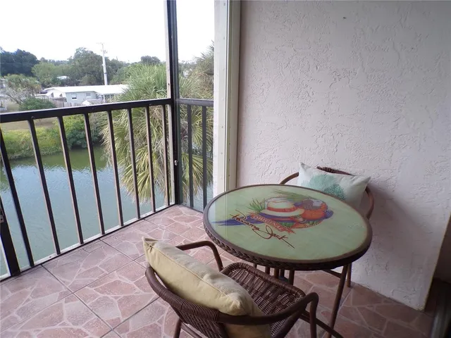 a view of a balcony dining area