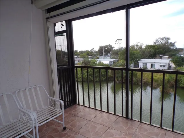 a view of a balcony with chair