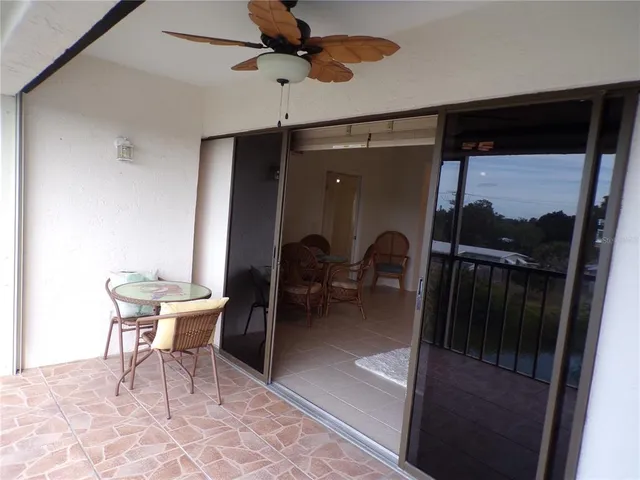a dining room with furniture and a rug