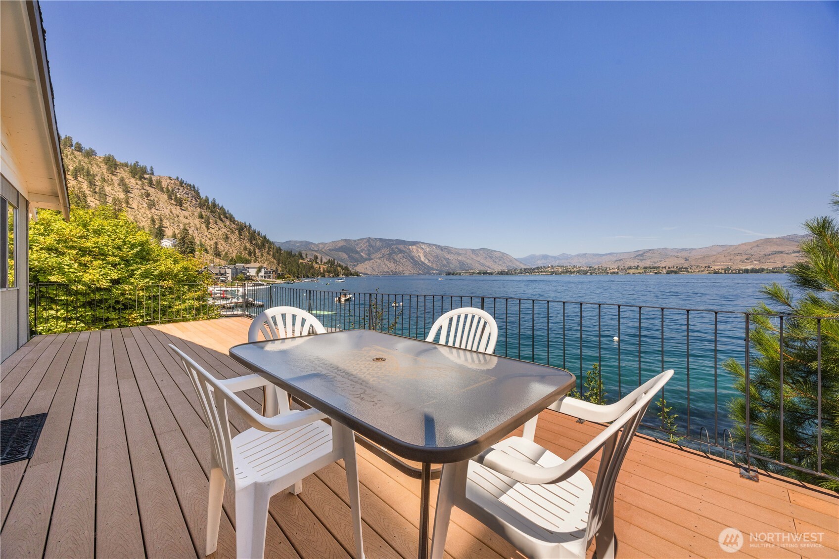 3132 South Lakeshore Road Chelan, WA 98816 - Photo 25 of 36 a view of a balcony with table and chairs