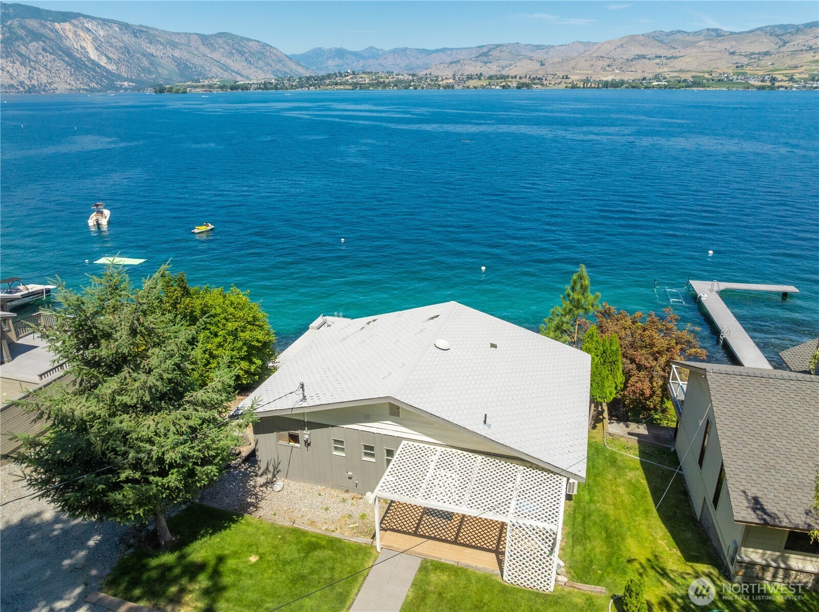 3132 South Lakeshore Road Chelan, WA 98816 - Photo 30 of 36 an aerial view of a house with a garden and plants