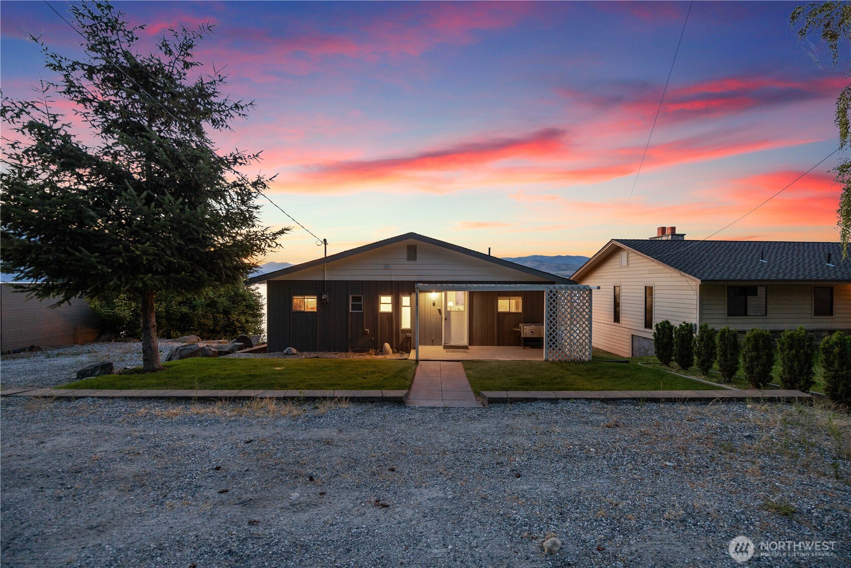3132 South Lakeshore Road Chelan, WA 98816 - Photo 32 of 36 a front view of a house with a yard