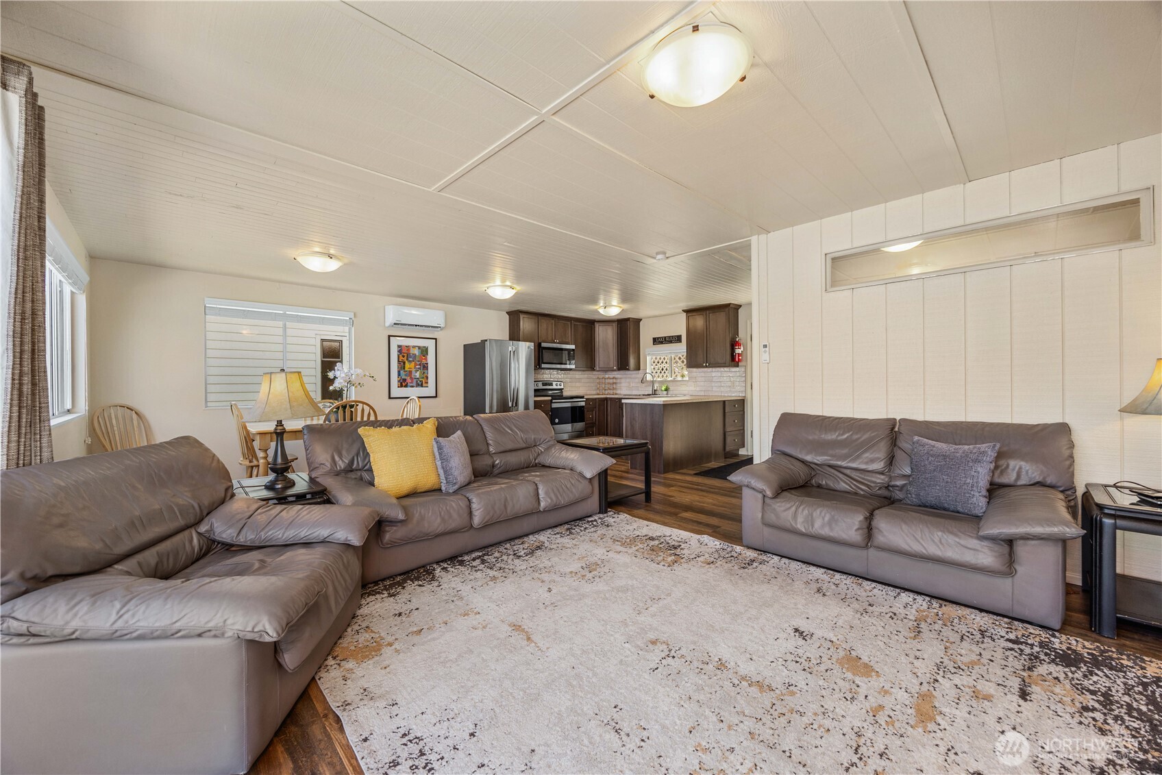 3132 South Lakeshore Road Chelan, WA 98816 - Photo 10 of 36 a living room with furniture and a chandelier