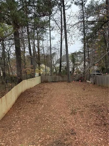 a view of outdoor space with deck and trees