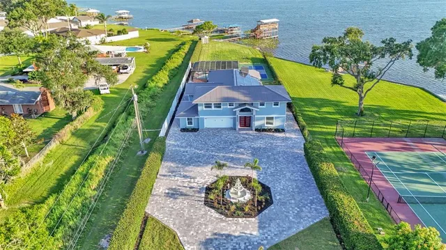 an aerial view of houses with yard