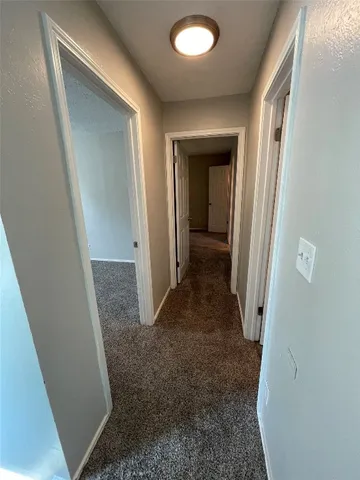 wooden floor with a bathroom