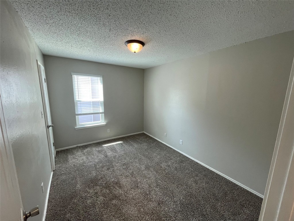 8810 Springmail Circle, Unit B Austin, TX 78729 - Photo 15 of 26 an empty room with windows