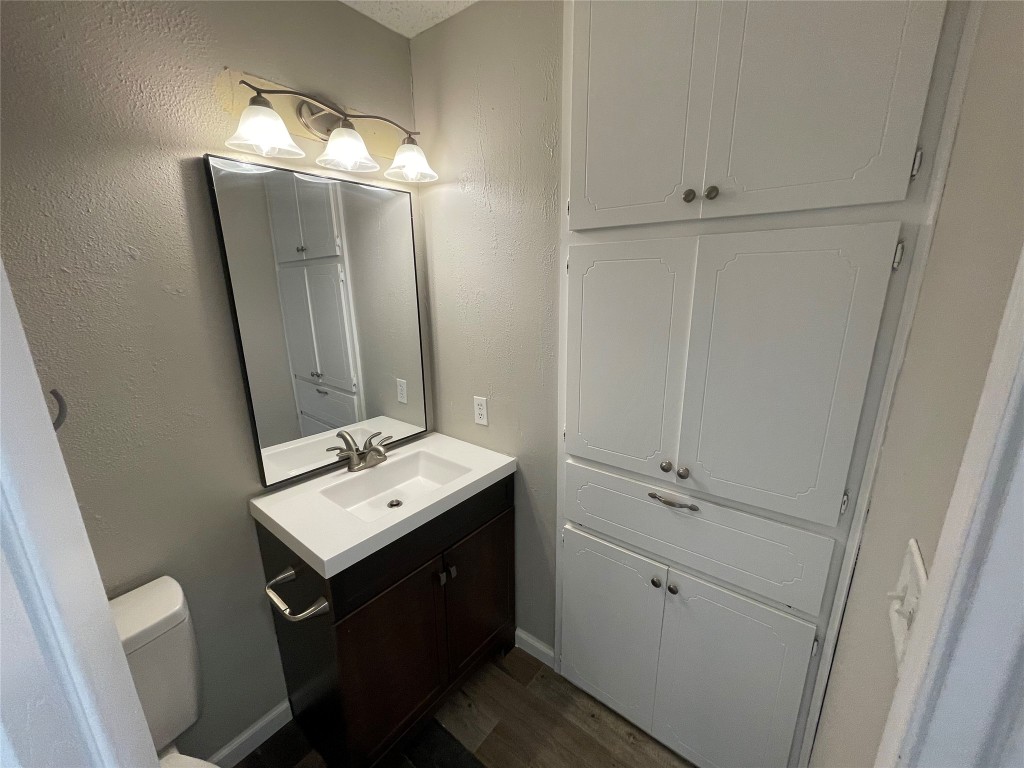 8810 Springmail Circle, Unit B Austin, TX 78729 - Photo 17 of 26 a bathroom with a sink vanity and mirror