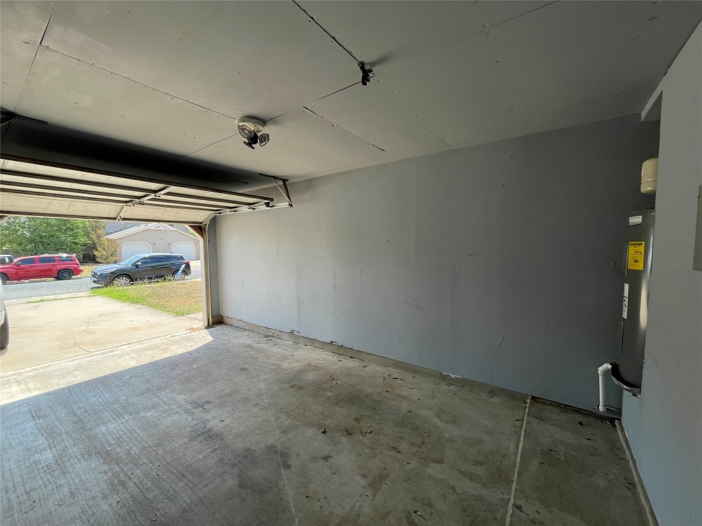 8810 Springmail Circle, Unit B Austin, TX 78729 - Photo 24 of 26 a view of garage and utility room