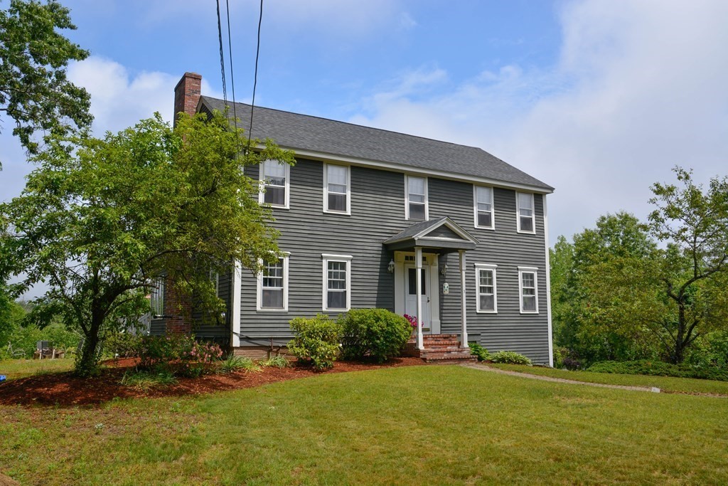 5 Wyman Road Townsend, MA 01474 - Photo 3 of 42 a front view of a house with a yard