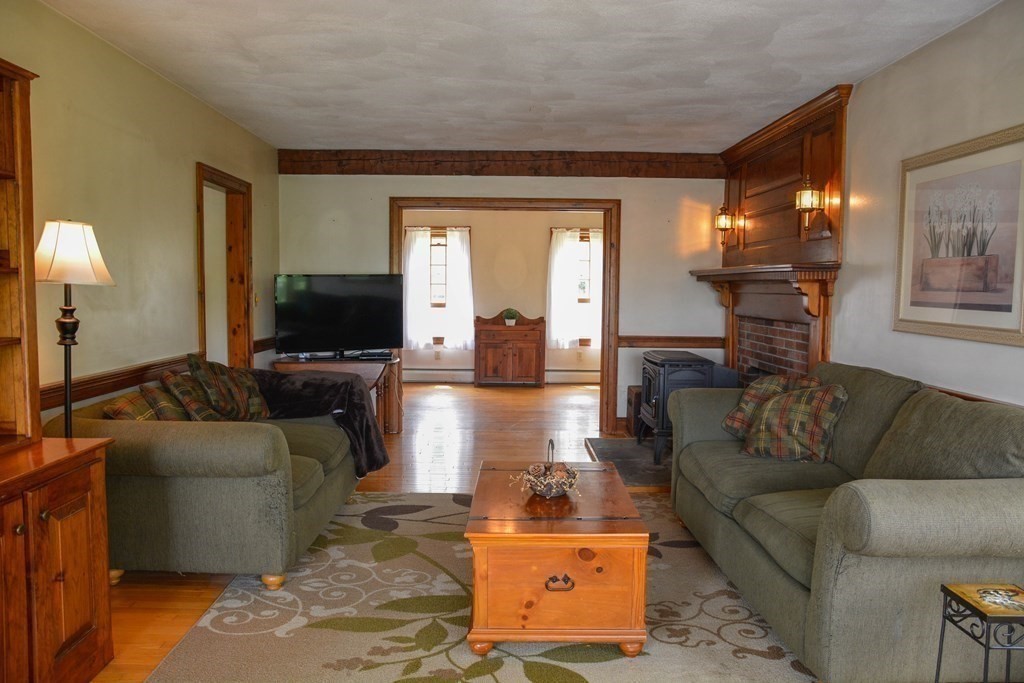5 Wyman Road Townsend, MA 01474 - Photo 8 of 42 a living room with furniture and a flat screen tv