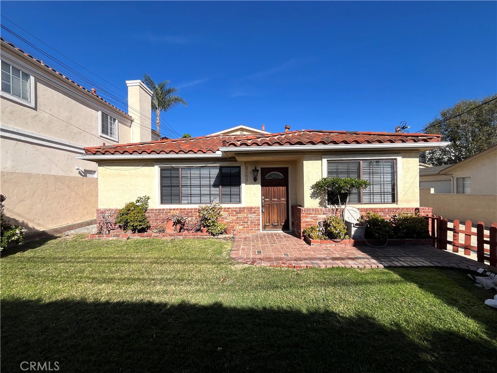 2103 Clark Lane, Unit A Redondo Beach, CA 90278 - Photo 1 of 14 a front view of a house with a garden and porch