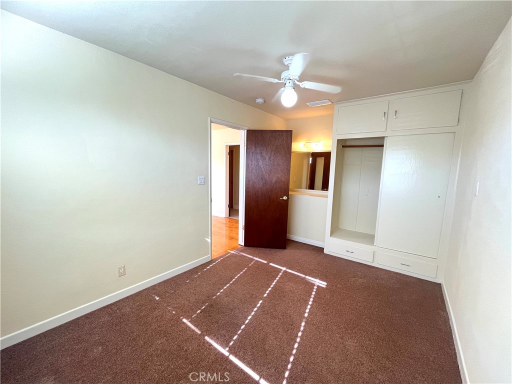 2103 Clark Lane, Unit A Redondo Beach, CA 90278 - Photo 4 of 14 an empty room with fan and entrance