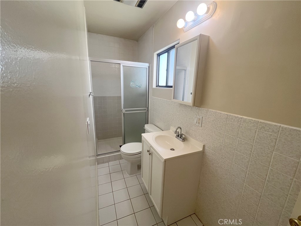 2103 Clark Lane, Unit A Redondo Beach, CA 90278 - Photo 7 of 14 a bathroom with a sink mirror and toilet