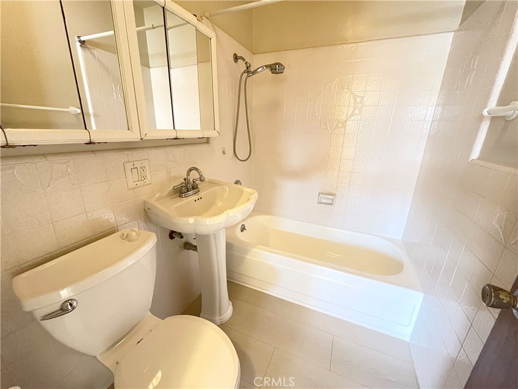 2103 Clark Lane, Unit A Redondo Beach, CA 90278 - Photo 9 of 14 a bathroom with a sink a toilet and a bathtub