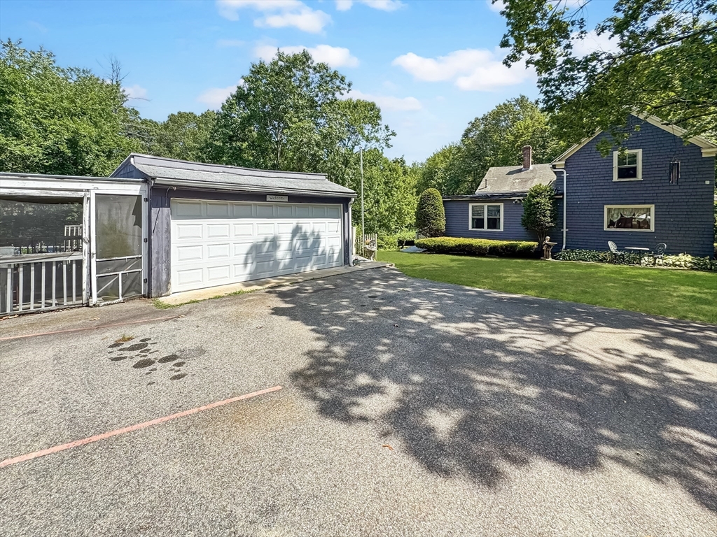 19 Haggetts Pond Road Andover, MA 01810 - Photo 3 of 24 a front view of a house with a yard and garage