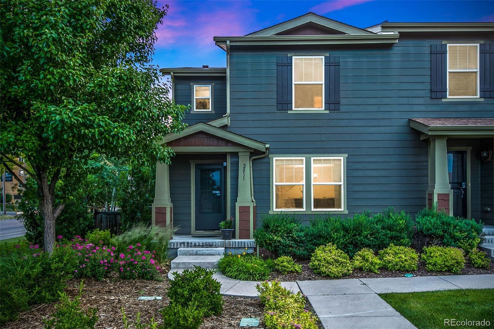 2011 Uinta Street Denver, CO 80238 - Photo 1 of 28 a front view of a house with garden