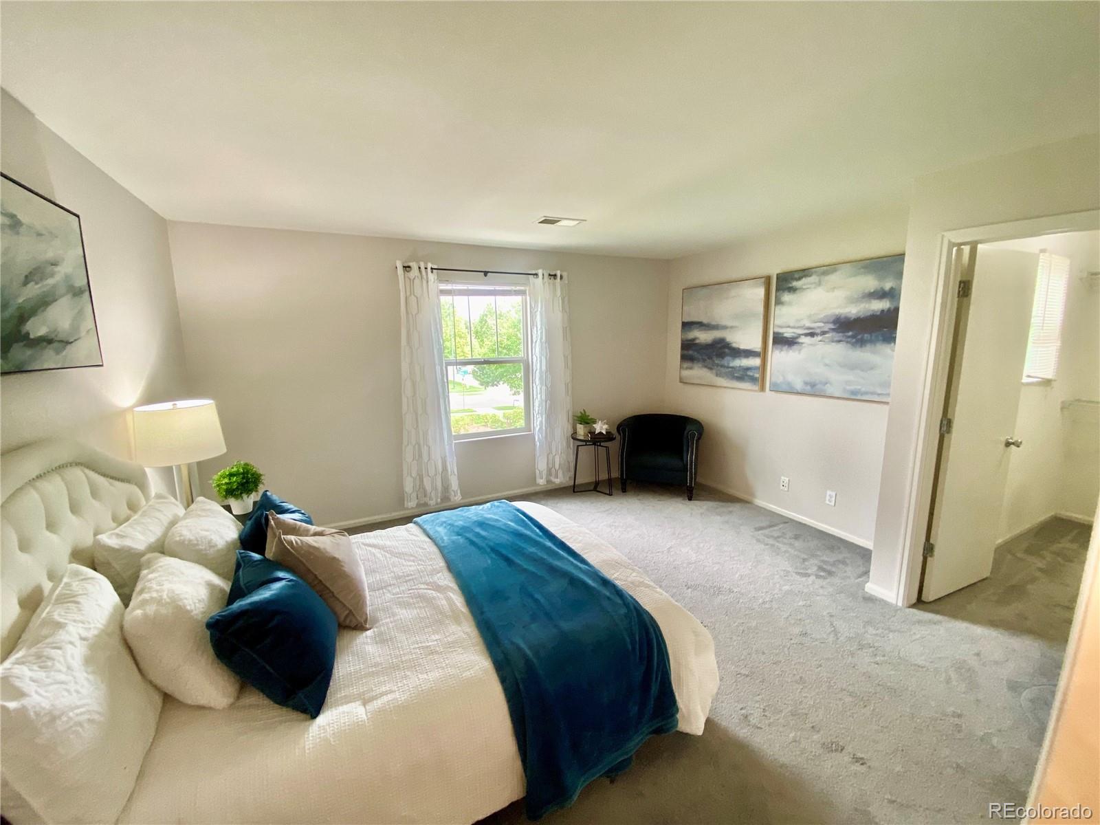 2011 Uinta Street Denver, CO 80238 - Photo 14 of 28 a bedroom with a bed and a window