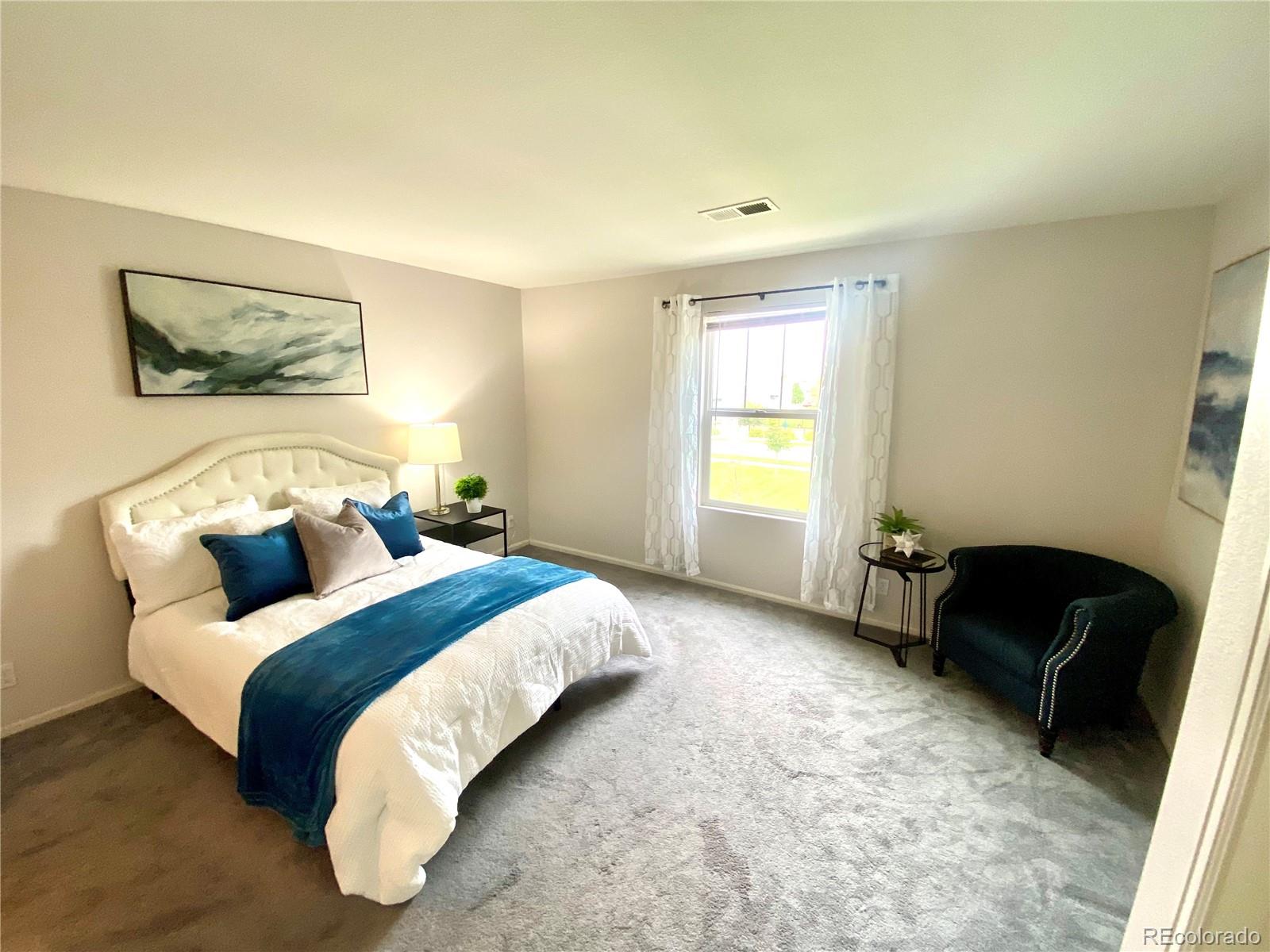 2011 Uinta Street Denver, CO 80238 - Photo 15 of 28 a bedroom with bed and a window