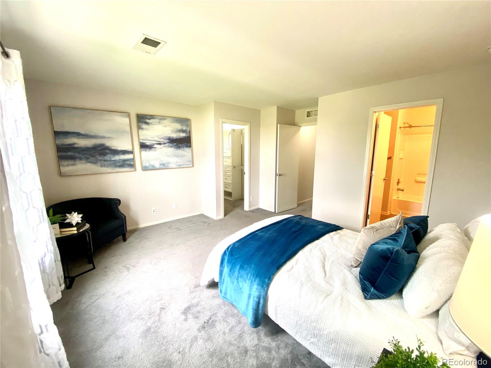 2011 Uinta Street Denver, CO 80238 - Photo 16 of 28 a bedroom with a bed and a large window