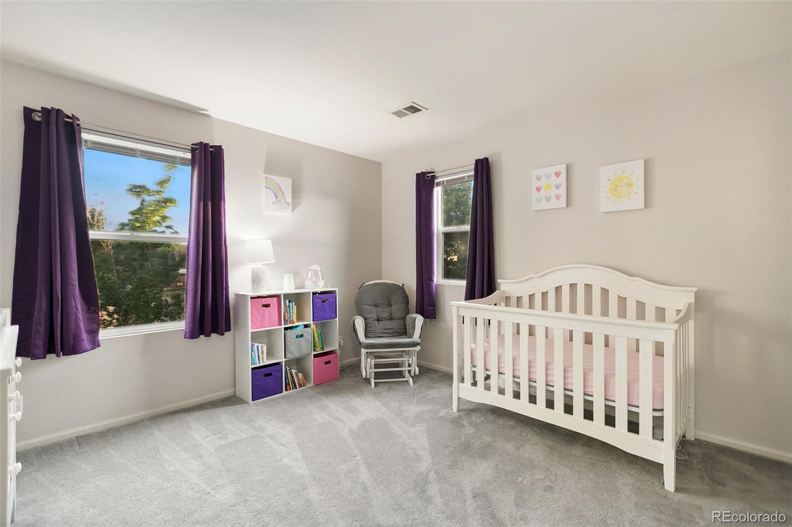 2011 Uinta Street Denver, CO 80238 - Photo 21 of 28 a bedroom with furniture and a window