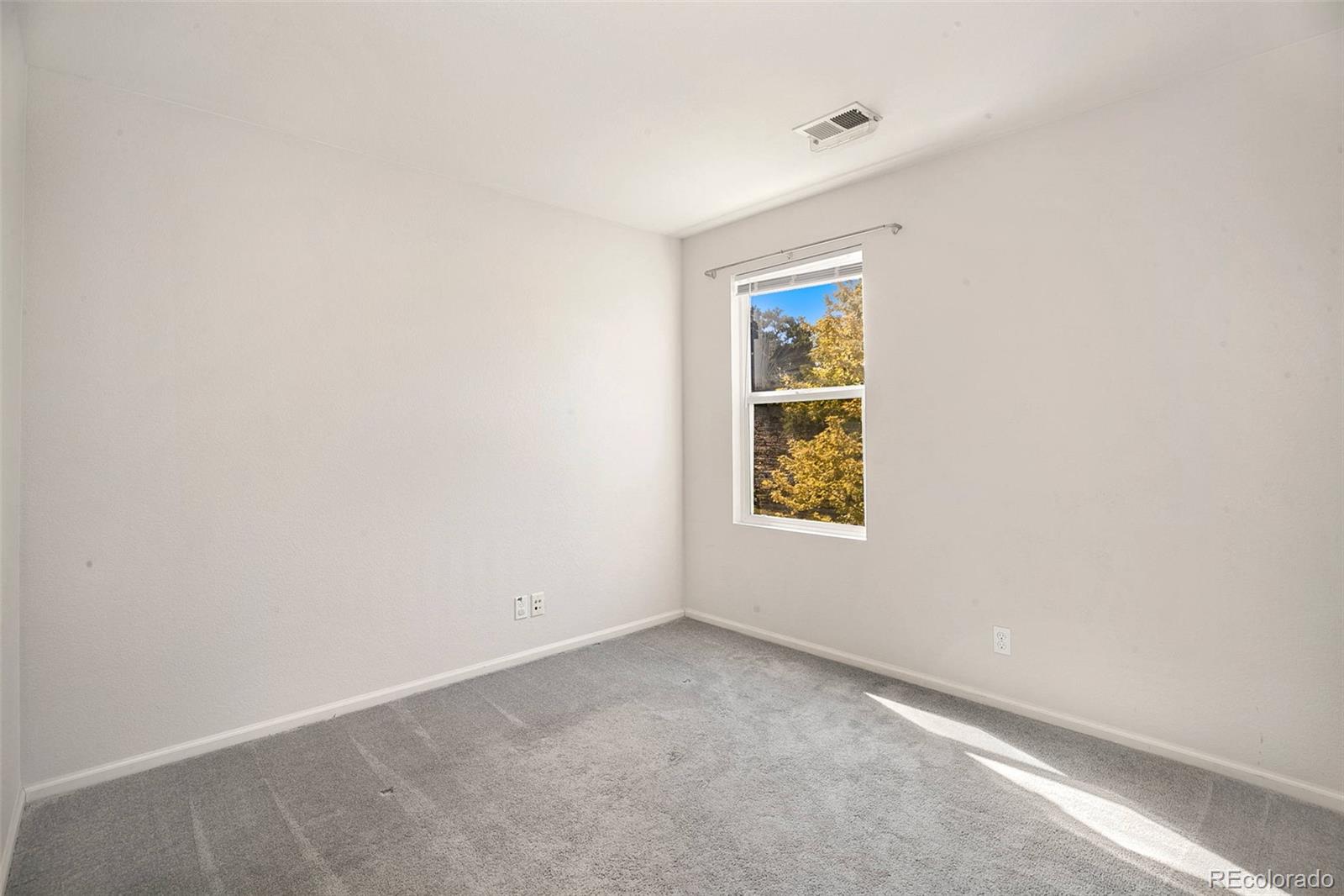 2011 Uinta Street Denver, CO 80238 - Photo 22 of 28 an empty room with a window