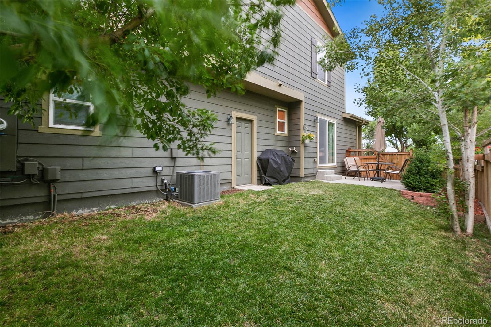 2011 Uinta Street Denver, CO 80238 - Photo 25 of 28 a view of a house with a backyard and a garden