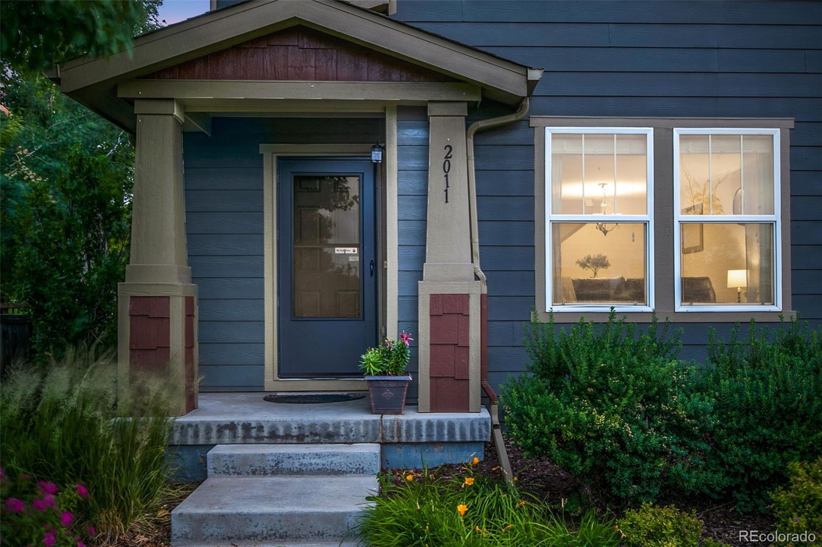 2011 Uinta Street Denver, CO 80238 - Photo 27 of 28 a front view of a house with a yard