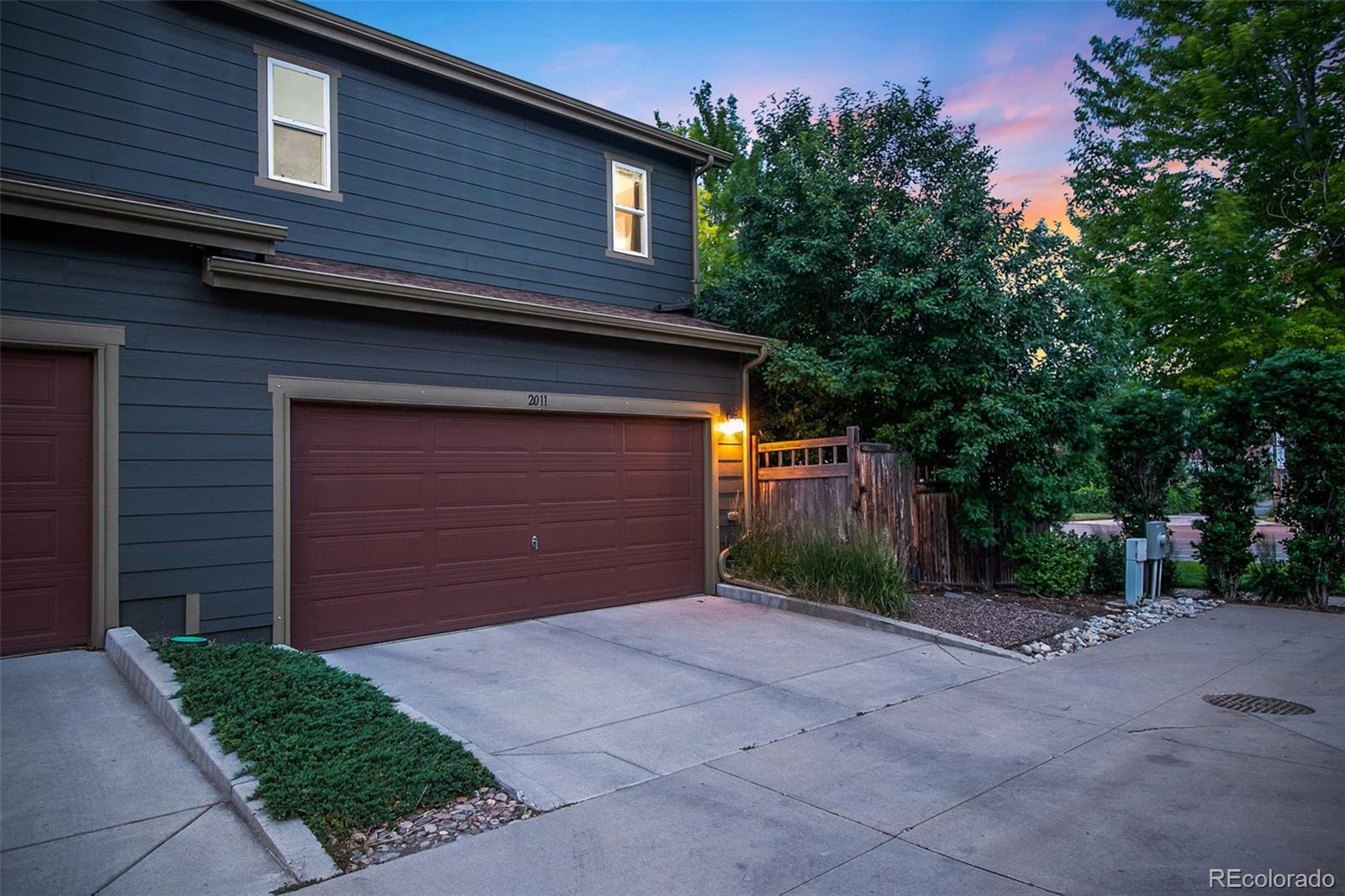 2011 Uinta Street Denver, CO 80238 - Photo 28 of 28 a front view of a house with a yard and garage
