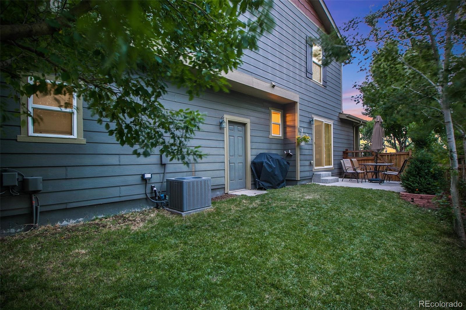 2011 Uinta Street Denver, CO 80238 - Photo 4 of 28 a backyard of a house with seating space