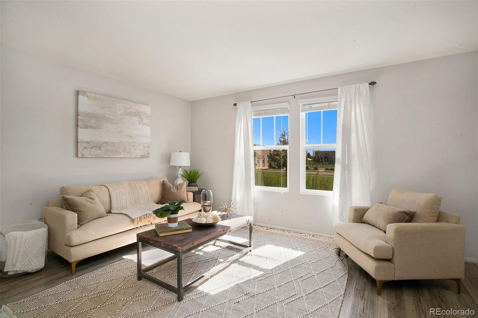 2011 Uinta Street Denver, CO 80238 - Photo 7 of 28 a living room with furniture and a large window