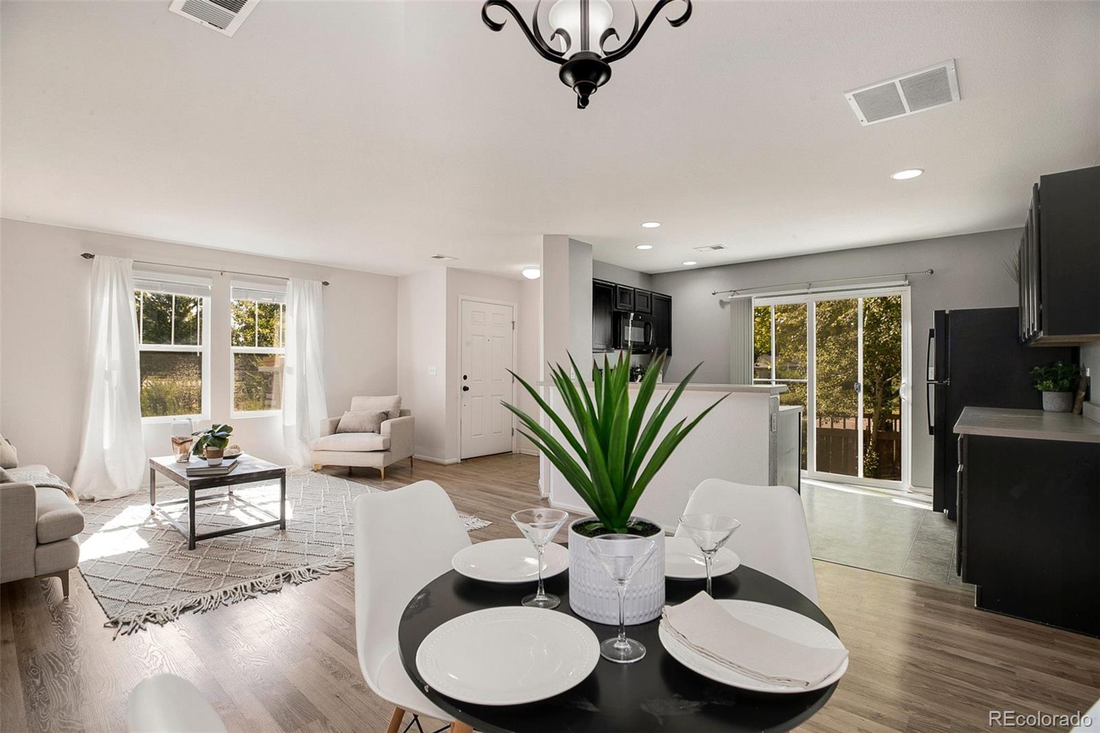 2011 Uinta Street Denver, CO 80238 - Photo 10 of 28 a living room with furniture potted plant and windows