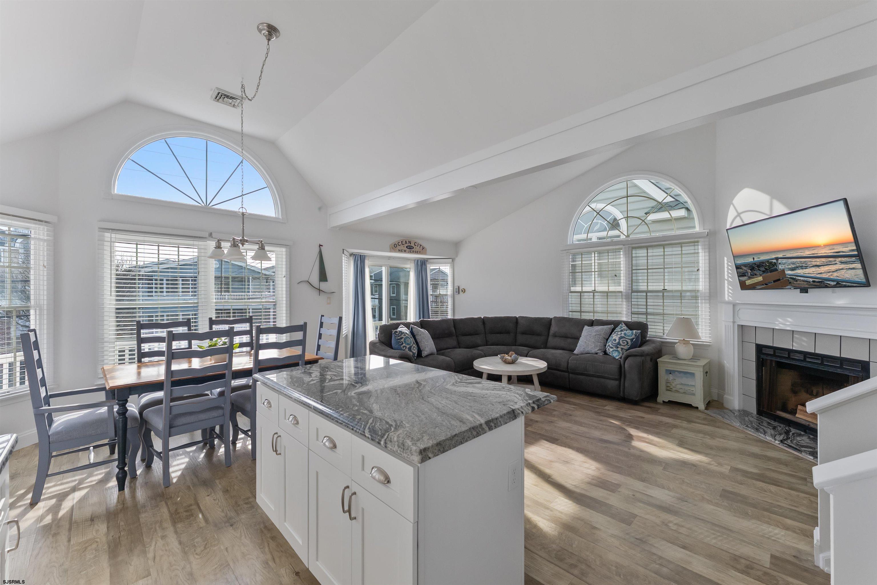 4930 Asbury Avenue, Unit 2 Ocean City, NJ 08226 - Photo 11 of 25 a living room with fireplace furniture and a large window