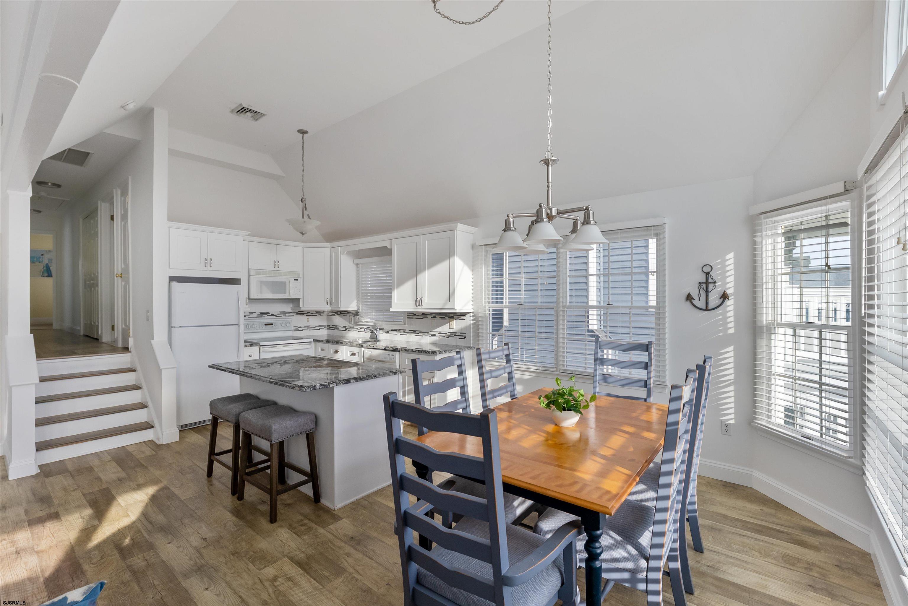 4930 Asbury Avenue, Unit 2 Ocean City, NJ 08226 - Photo 13 of 25 a view of a dining room with furniture window and outside view