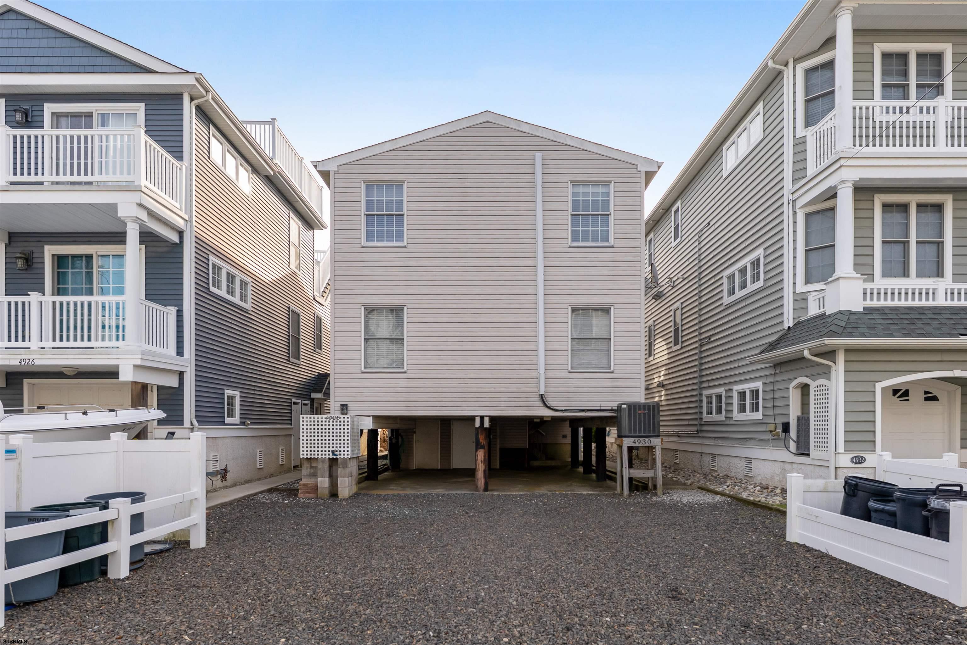 4930 Asbury Avenue, Unit 2 Ocean City, NJ 08226 - Photo 23 of 25 a large brick building with a table and chairs