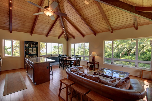 500 North Holokai Place Haiku, HI 96708 - Photo 11 of 17 a living room with furniture a wooden floor and a large window