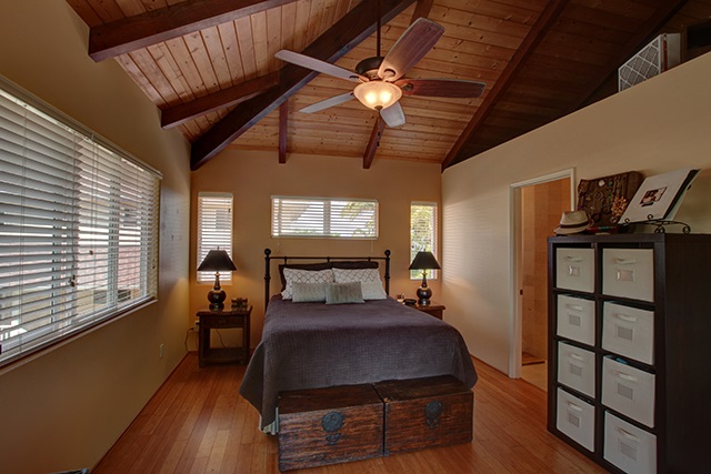 500 North Holokai Place Haiku, HI 96708 - Photo 13 of 17 a bedroom with furniture and a window