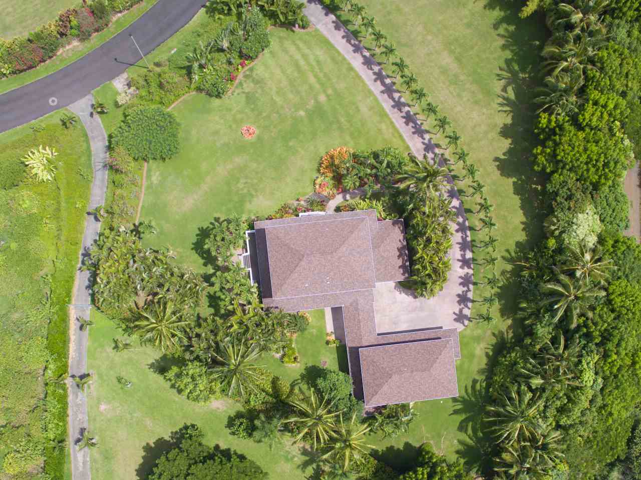 500 North Holokai Place Haiku, HI 96708 - Photo 16 of 17 an aerial view of a house with a yard and garden in the back
