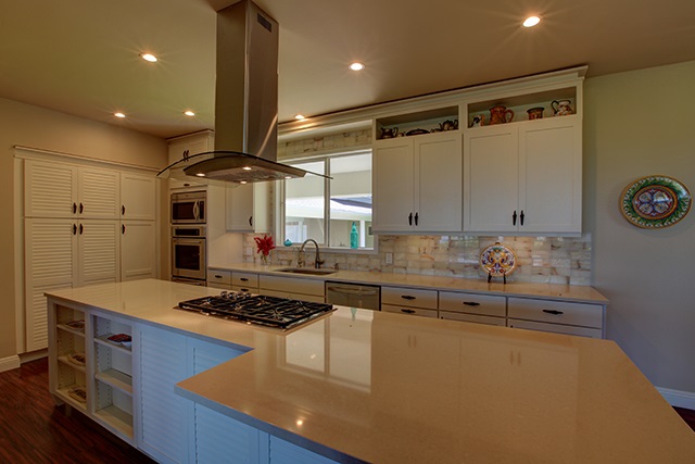 500 North Holokai Place Haiku, HI 96708 - Photo 4 of 17 a kitchen with stainless steel appliances granite countertop a stove and a refrigerator