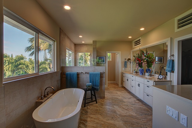 500 North Holokai Place Haiku, HI 96708 - Photo 8 of 17 a large bathroom with a large window and double vanity