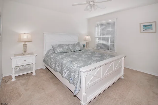 a bed room with a bed and a window