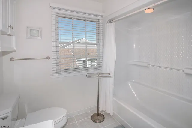 a bathroom with a tub and a shower