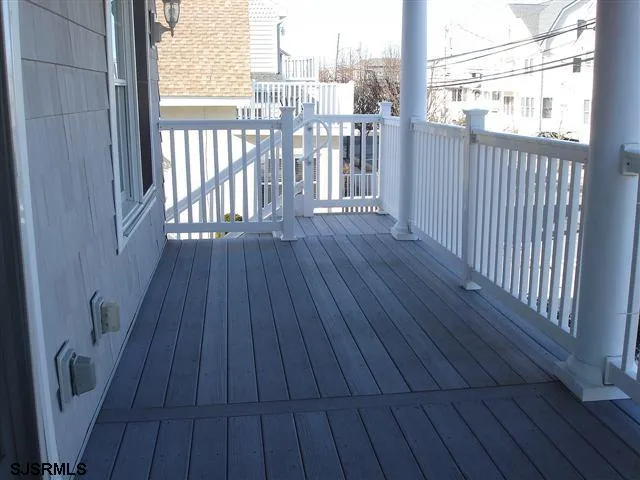 a view of a balcony with furniture
