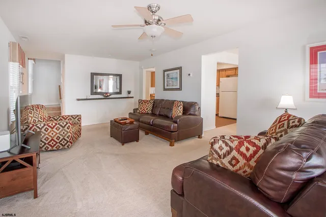 a bedroom with furniture and a lamp