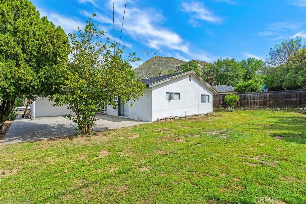 786 Spruce Street Riverside, CA 92507 - Photo 28 of 29 a view of a backyard with large trees and plants