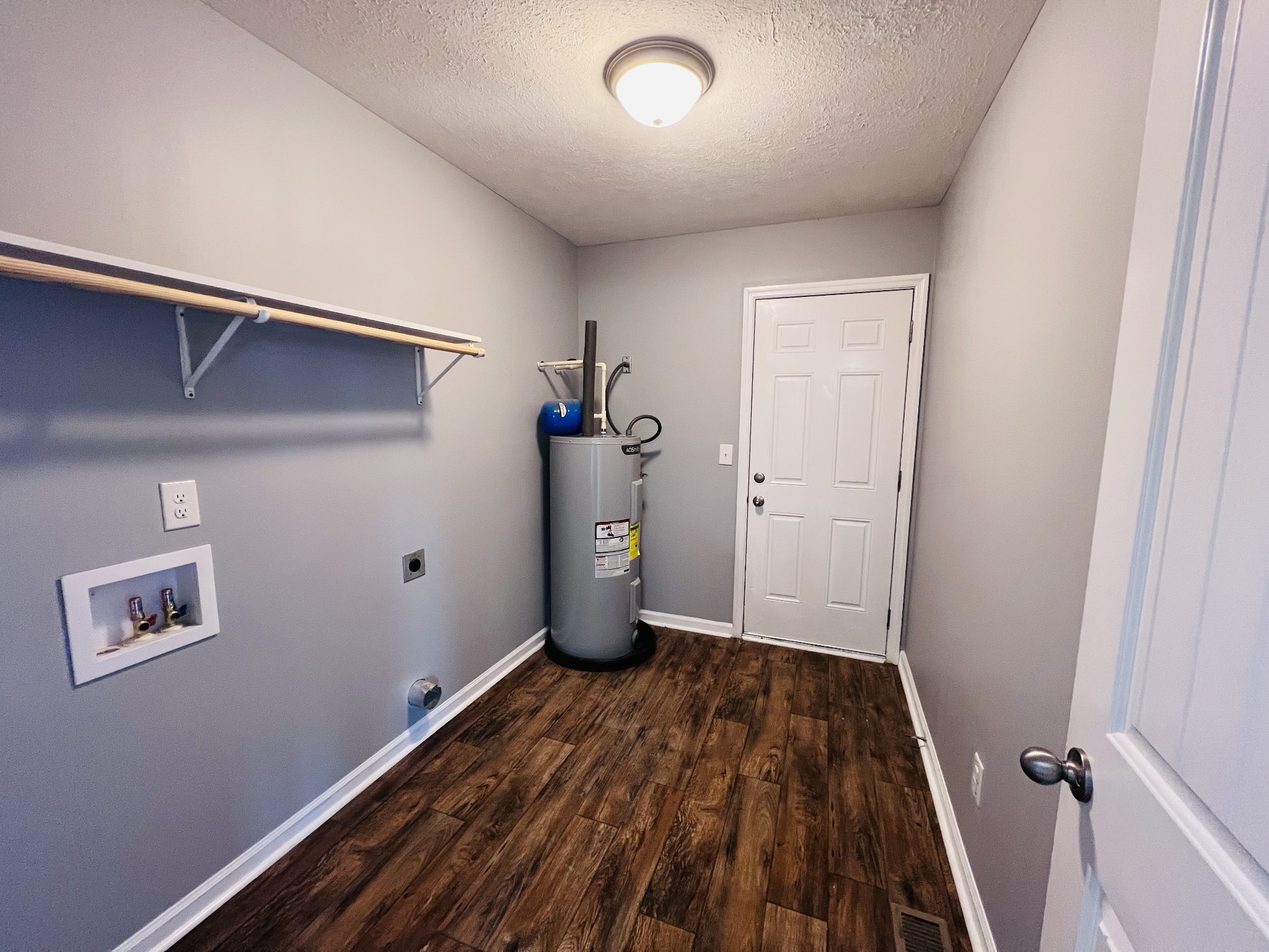 4759 Little Dry Creek Road Pulaski, TN 38478 - Photo 14 of 18 a view of a room with wooden floor and closet