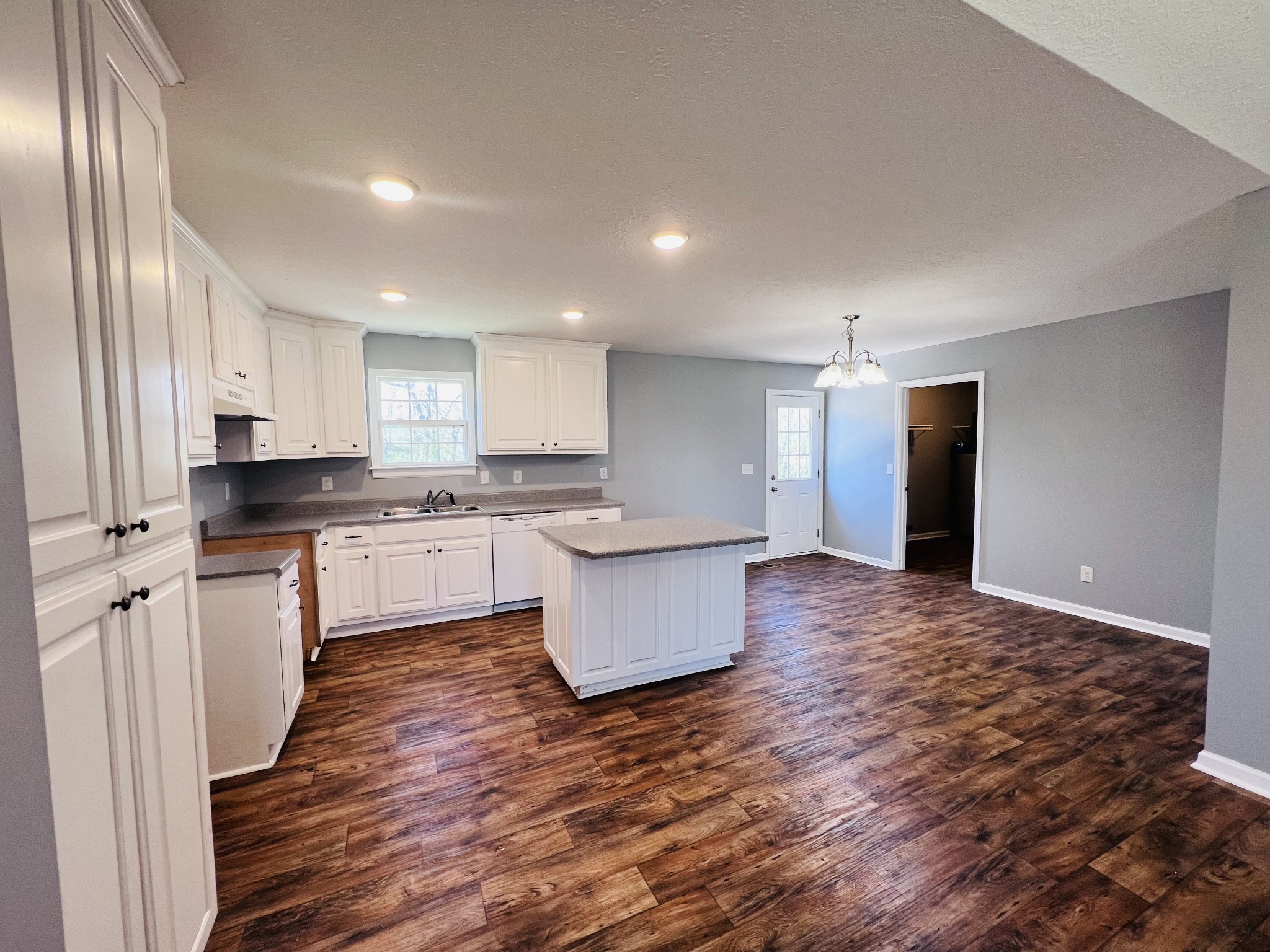 4759 Little Dry Creek Road Pulaski, TN 38478 - Photo 4 of 18 a large kitchen with stainless steel appliances granite countertop a large counter top a sink and a stove