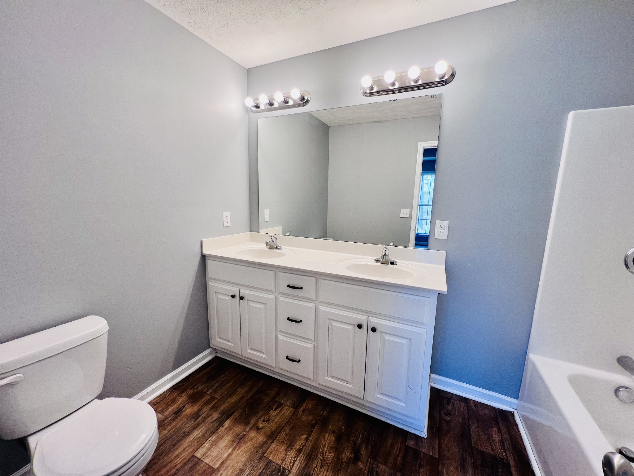 4759 Little Dry Creek Road Pulaski, TN 38478 - Photo 7 of 18 a bathroom with a double vanity sink and a toilet